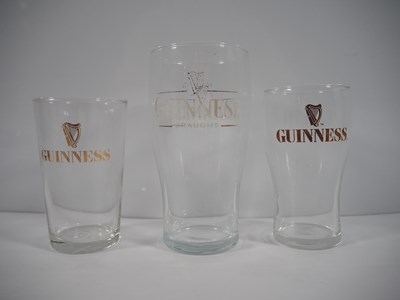 Lot 409 - A group of 16 Guinness drinking glasses of...