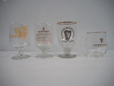 Lot 409 - A group of 16 Guinness drinking glasses of...