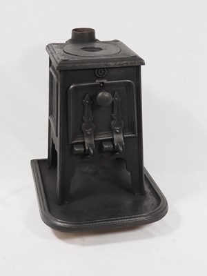 Lot 276 - A cast iron wood burning stove of small...