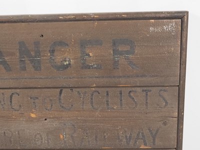 Lot 310 - An early-20th century railway crossing sign...