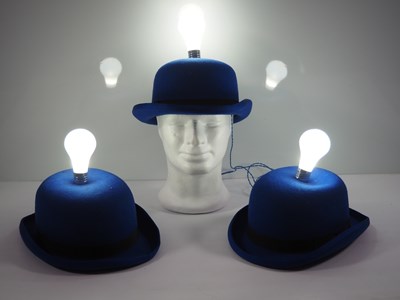 Lot 335 - A group of three light-up bulb blue bowler...