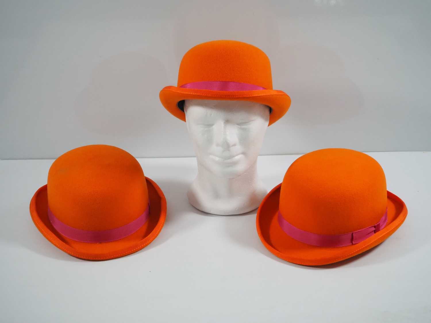 Lot 337 - A group of three orange bowler hats by