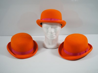 Lot 337 - A group of three orange bowler hats by...