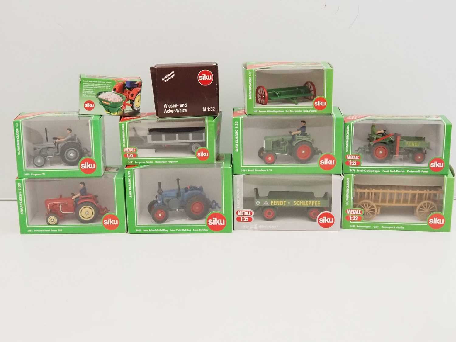 Lot 87 - A group of SIKU 1:32 scale diecast tractors,...