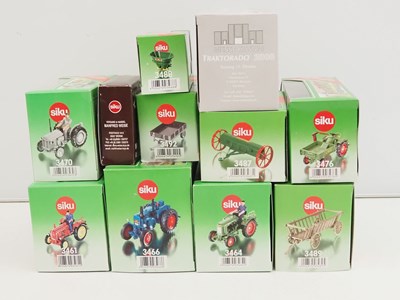 Lot 87 - A group of SIKU 1:32 scale diecast tractors,...