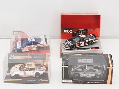 Lot 357 - A group of slot racing cars by SCX and...