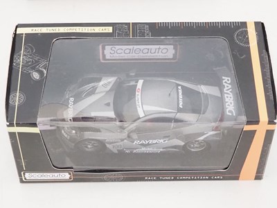 Lot 357 - A group of slot racing cars by SCX and...