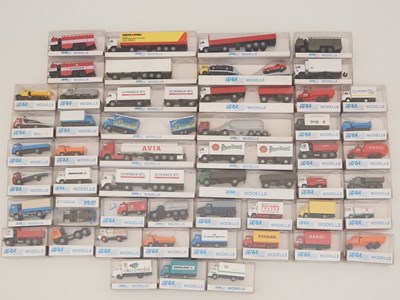 Lot 414 - A large quantity of HO scale lorries and vans,...