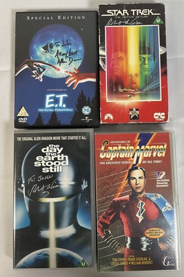 Lot 298 - A collection of autographed VHS tapes and DVDs...