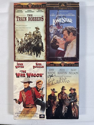 Lot 299 - A collection of autographed Western movie VHS...
