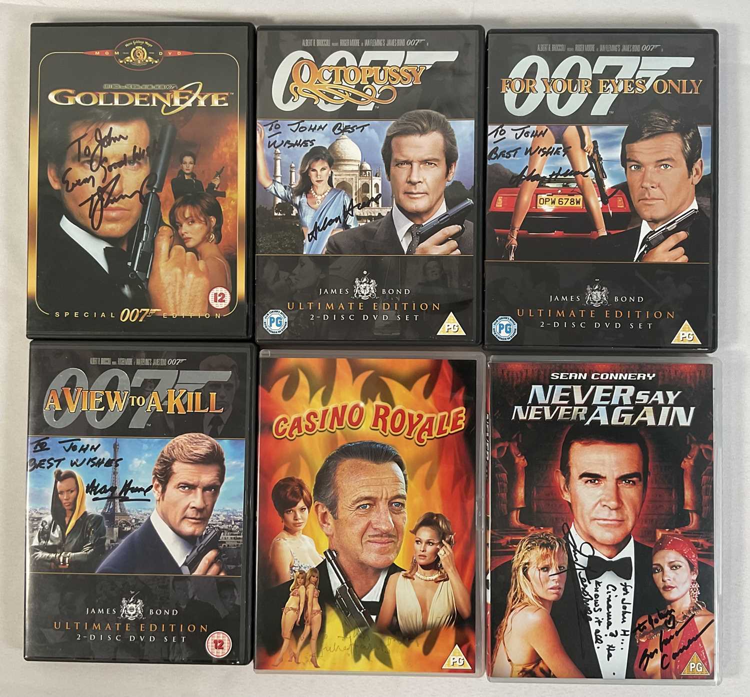 Lot 384 - A group of 6 autographed James Bond DVDs...