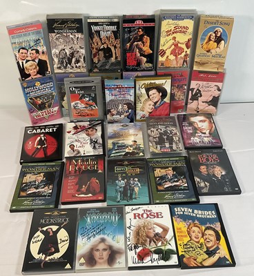 Lot 297 - A collection of autographed Musical VHS tapes...