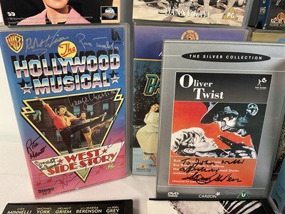 Lot 297 - A collection of autographed Musical VHS tapes...