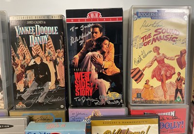 Lot 297 - A collection of autographed Musical VHS tapes...