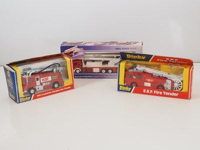 Lot 32 - A group of boxed fire engines by DINKY and...