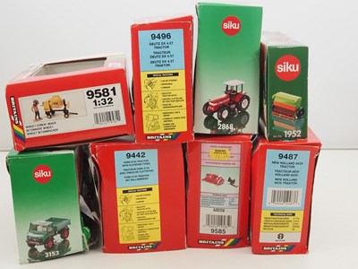 Lot 137 - A group of 1:32 scale diecast tractors and...