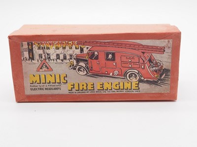 Lot 186 - A TRIANG MINIC 62ME pre-war tinplate clockwork...