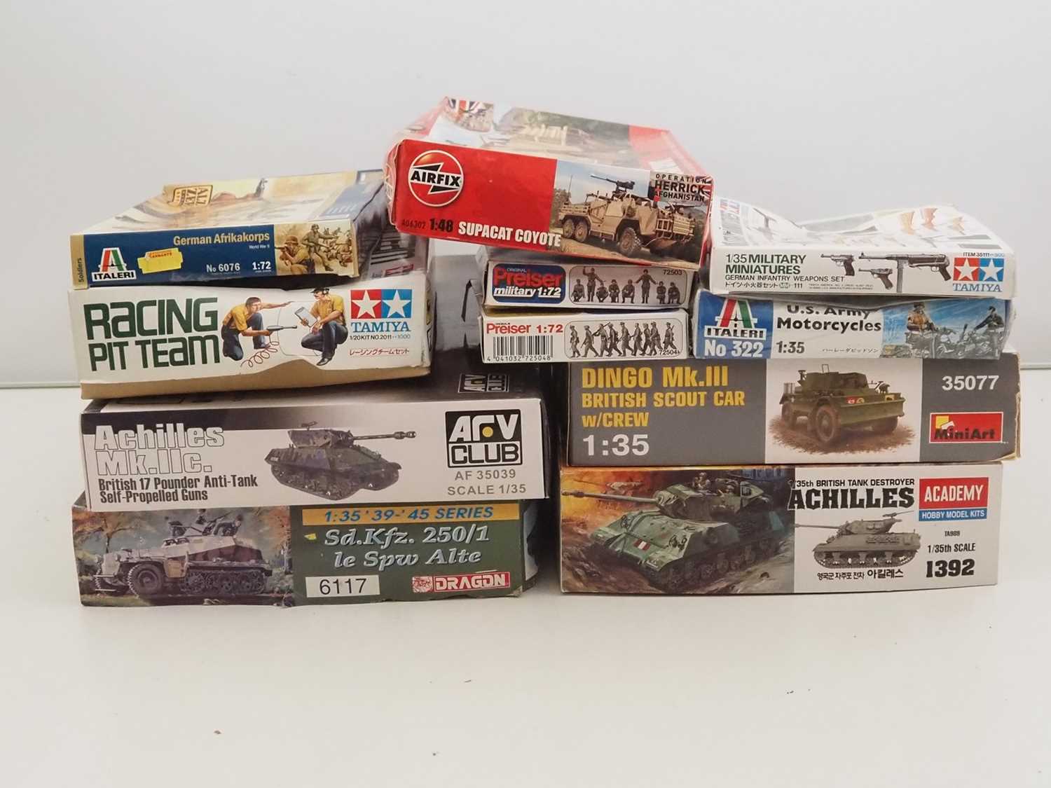 Lot 229 - A group of unbuilt plastic military vehicle...