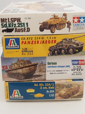 Lot 231 - A group of unbuilt plastic military vehicle...