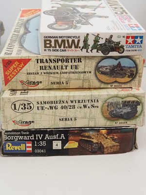 Lot 232 - A group of unbuilt plastic military vehicle...