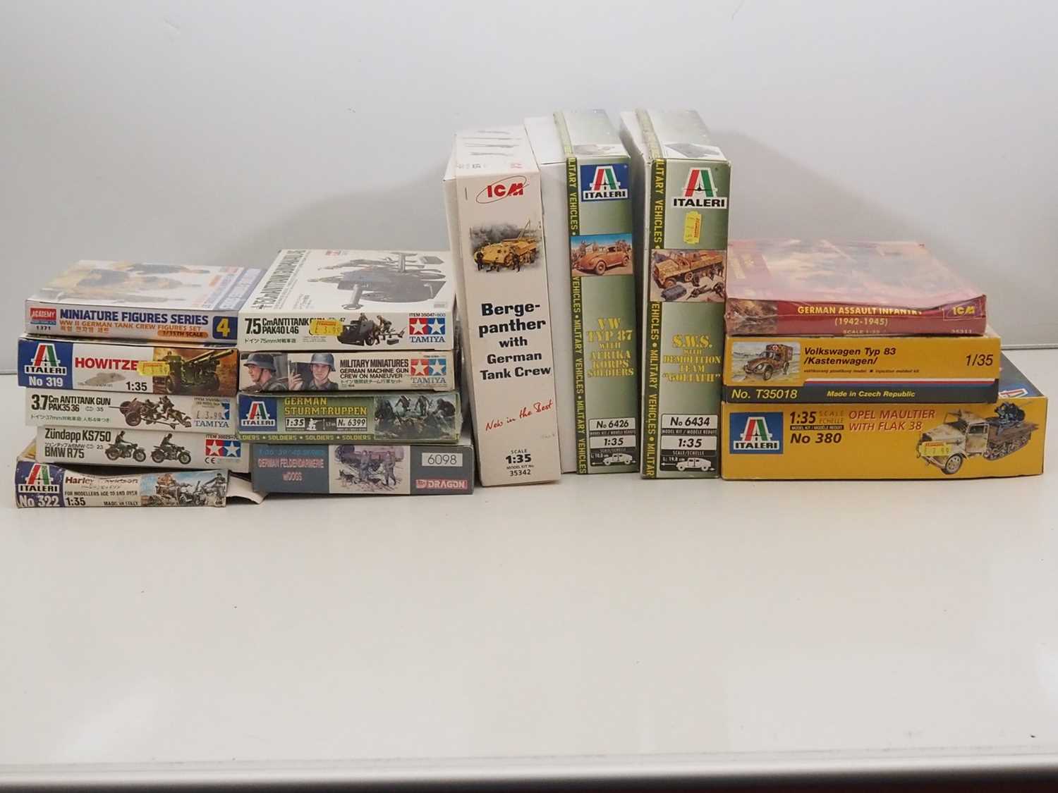 Lot 233 - A group of unbuilt plastic military vehicle...