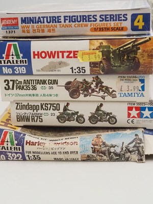 Lot 233 - A group of unbuilt plastic military vehicle...