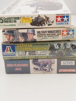 Lot 233 - A group of unbuilt plastic military vehicle...