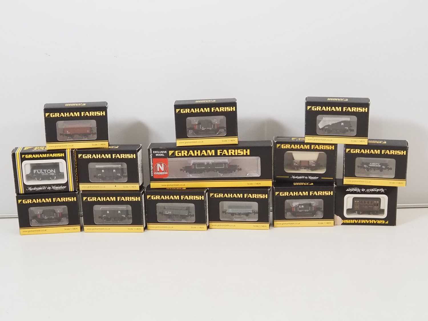 Lot 280 - A group of GRAHAM FARISH N gauge wagons,...