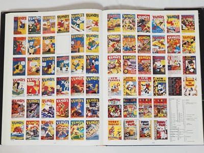 Lot 319 - THE PHOTO-JOURNAL GUIDE TO COMIC BOOKS:...