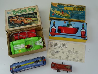 Lot 11 - VINTAGE TOYS: A battery operated MARX racing...