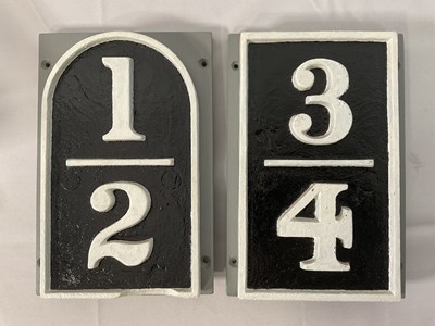 Lot 484 - A pair of cast iron mile posts, both with...