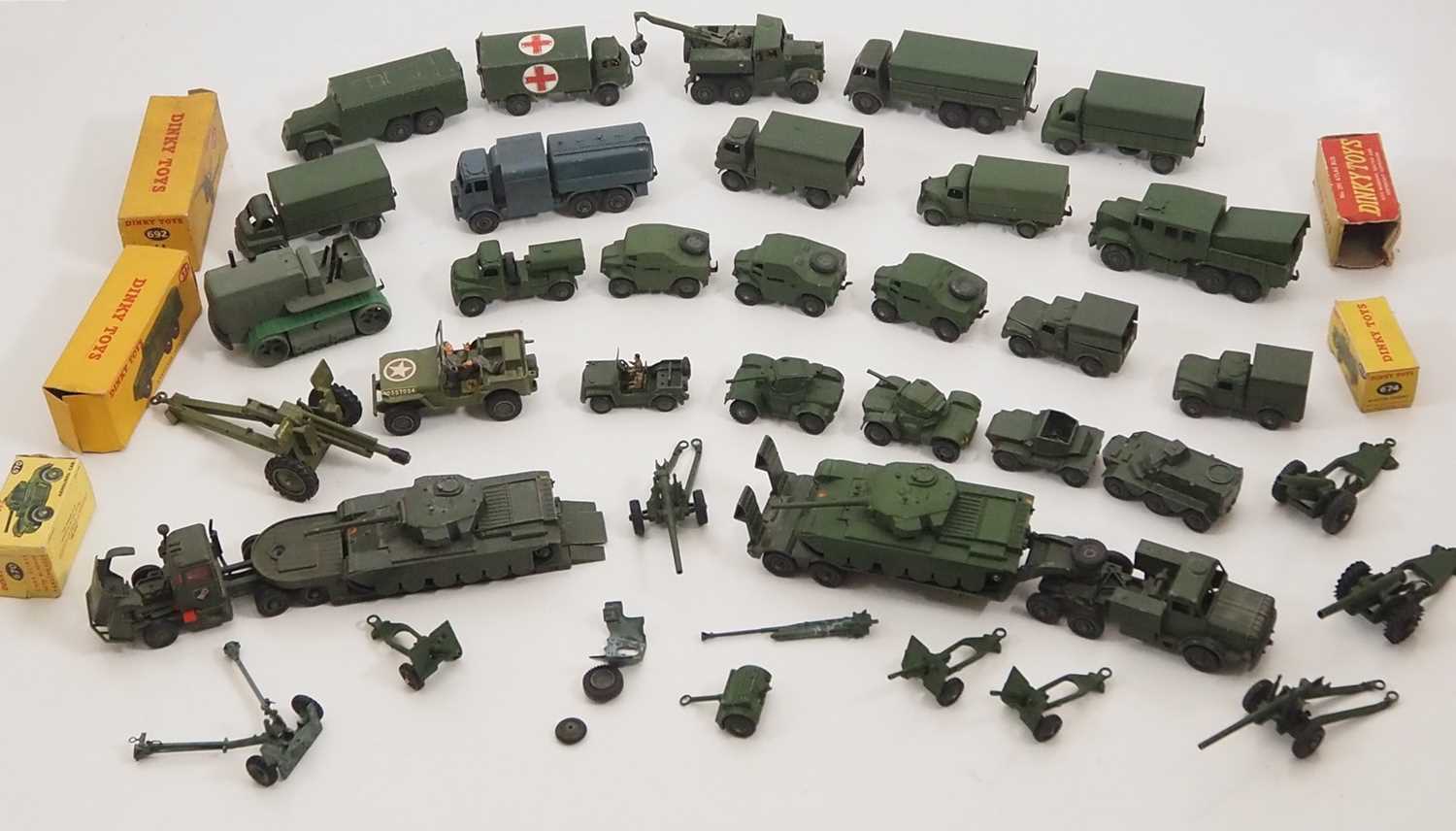 Lot 14 - A large tray of military diecast vehicles by...