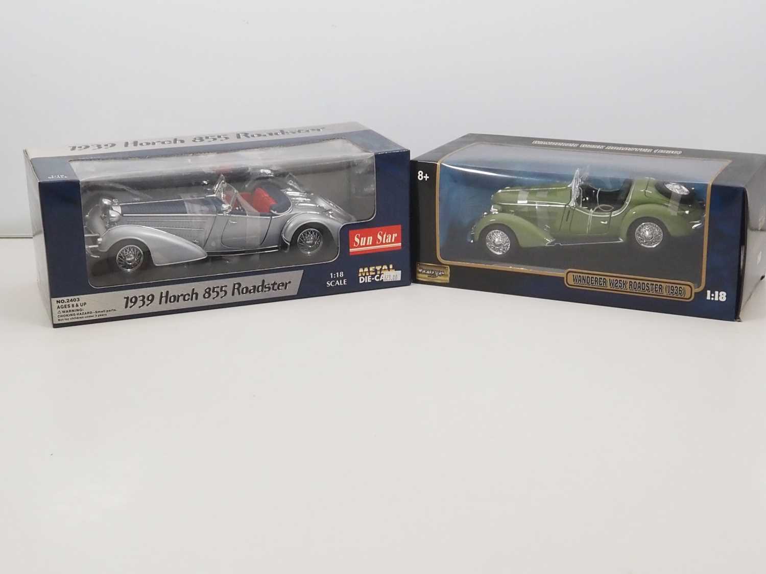 Lot 18 - A pair of 1:18 scale diecast cars by SUNSTAR...
