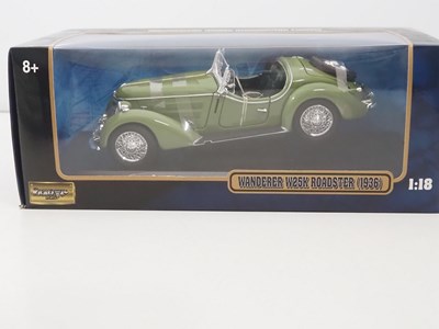 Lot 18 - A pair of 1:18 scale diecast cars by SUNSTAR...