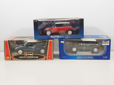 Lot 22 - A group of diecast 1:18 scale Mini Cooper cars...
