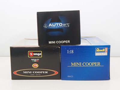 Lot 22 - A group of diecast 1:18 scale Mini Cooper cars...