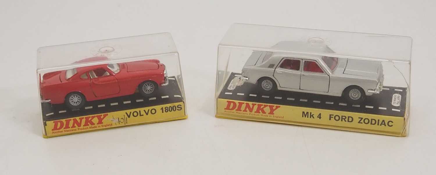 Lot 114 - A pair of DINKY diecast cars in original hard...