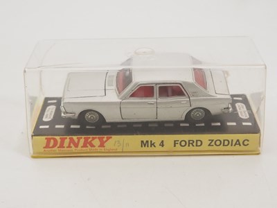 Lot 114 - A pair of DINKY diecast cars in original hard...