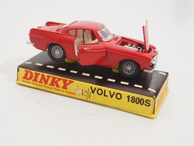 Lot 114 - A pair of DINKY diecast cars in original hard...