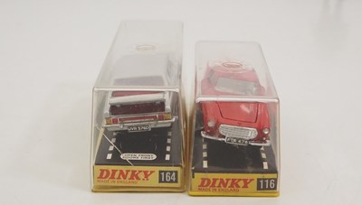 Lot 114 - A pair of DINKY diecast cars in original hard...