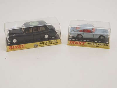 Lot 115 - A pair of DINKY diecast cars in original hard...