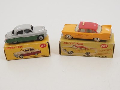 Lot 180 - A pair of DINKY diecast cars comprising a 164...