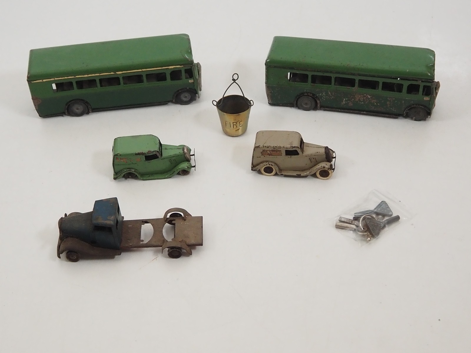 A Tri-ang Minic tinplate clockwork police car with loudspeaker and two A Tri-ang Minic tinplate clockwork police car with loudspeaker and two