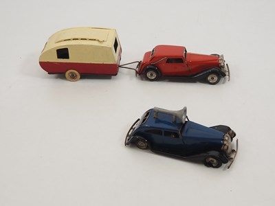 Lot 250 - A group of vintage TRIANG MINIC clockwork cars...