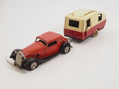 Lot 250 - A group of vintage TRIANG MINIC clockwork cars...