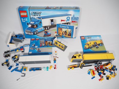 Lot 113 - LEGO - CITY - A pair of truck sets comprising...