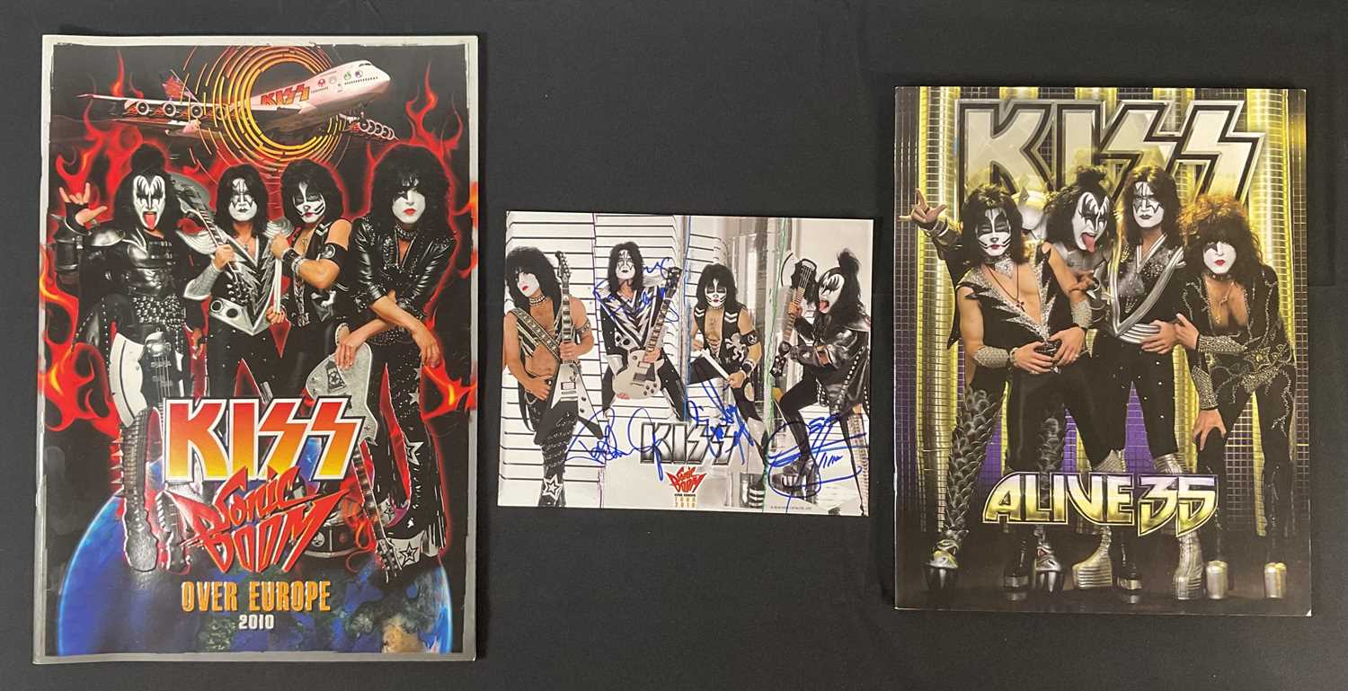 Lot 340 - A KISS 2010 Sonic Boom tour photo card signed...