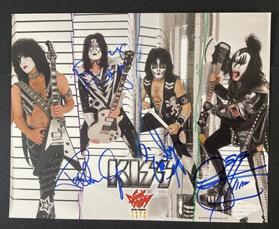 Lot 340 - A KISS 2010 Sonic Boom tour photo card signed...