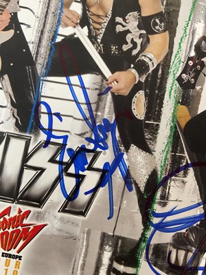 Lot 340 - A KISS 2010 Sonic Boom tour photo card signed...