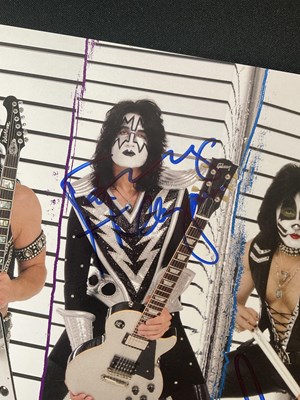 Lot 340 - A KISS 2010 Sonic Boom tour photo card signed...